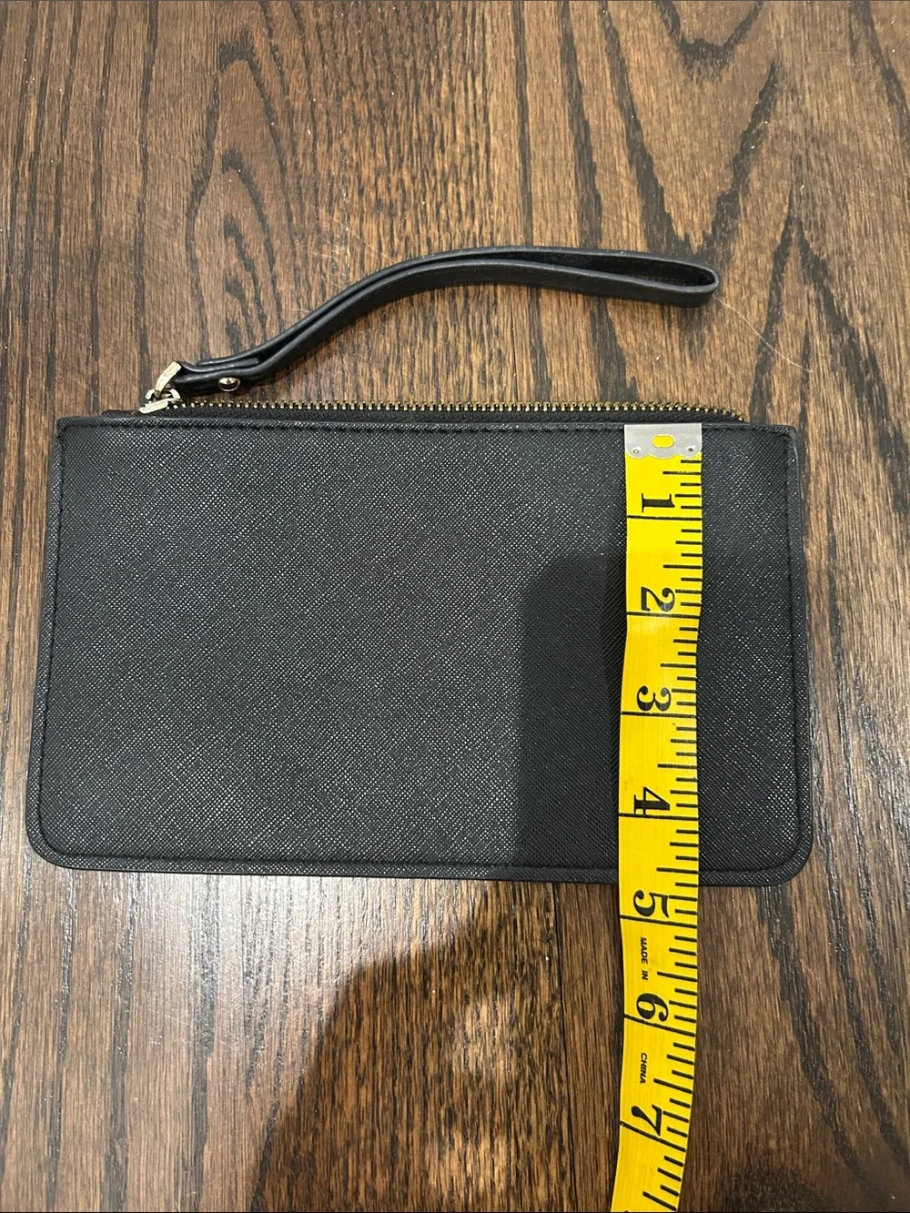 kate spade black and gold wristlet pouch